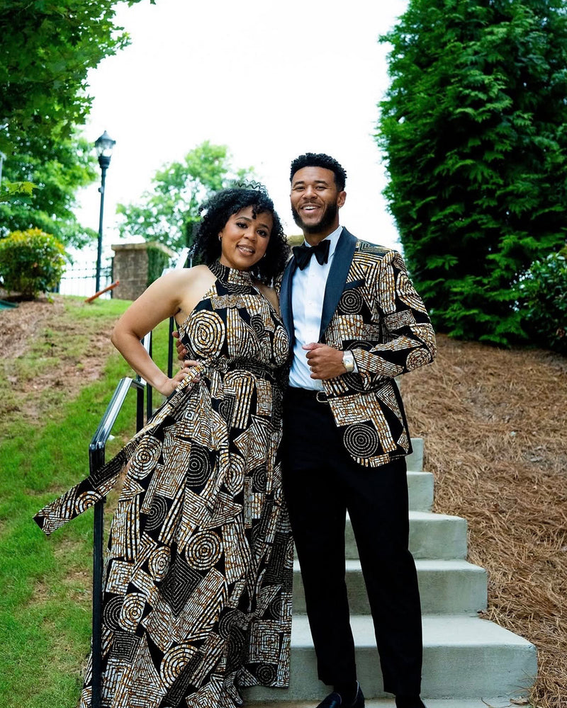 Front view of African Print Halter Maxi Dress showcasing black and brown geometric pattern on a model outdoors