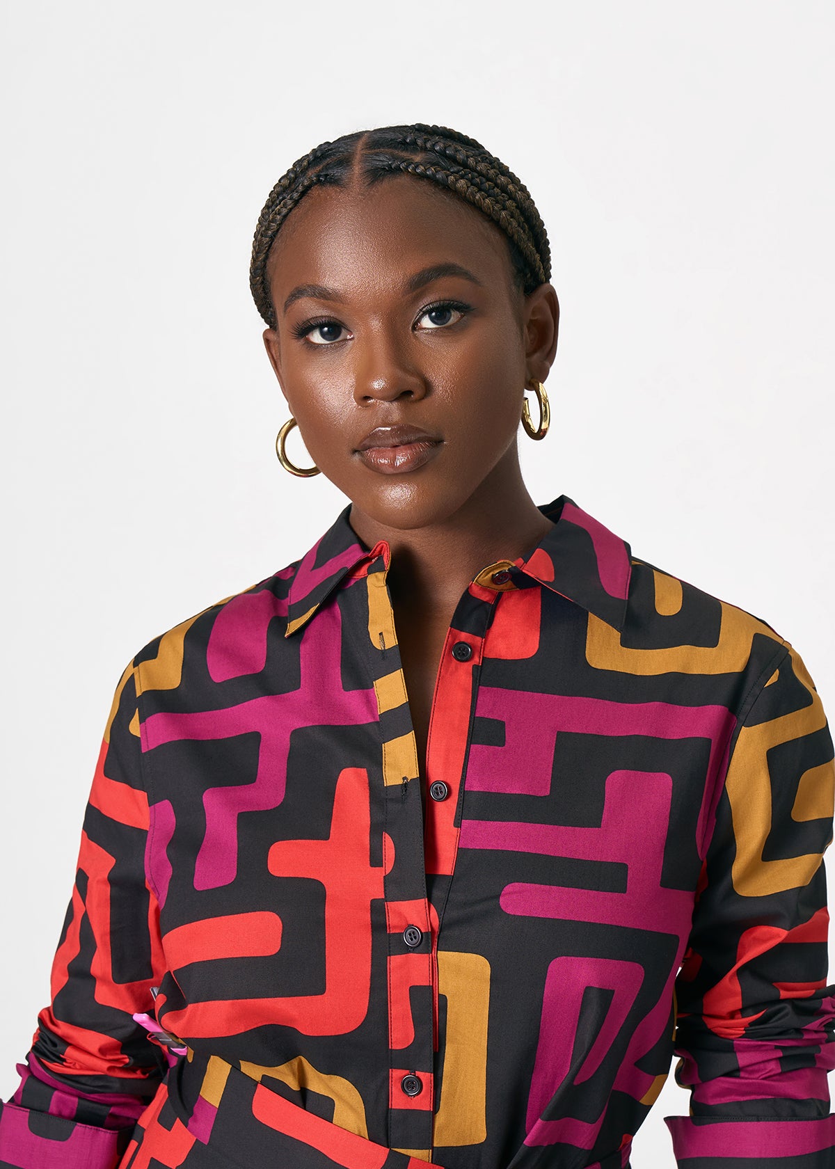Front view of Kianga women’s African print shirt dress showcasing collared button front and bold Black Berry Kuba geometric print on light background